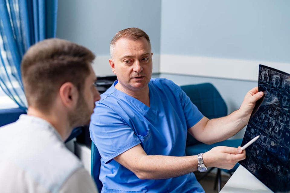 radiologist analyzes study results for a patient